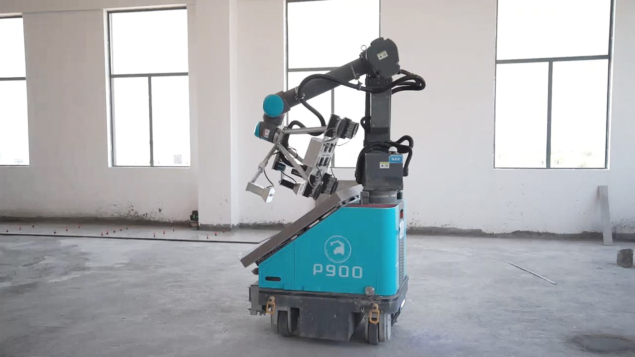 P900 floor-tiling robot in a prepared interior