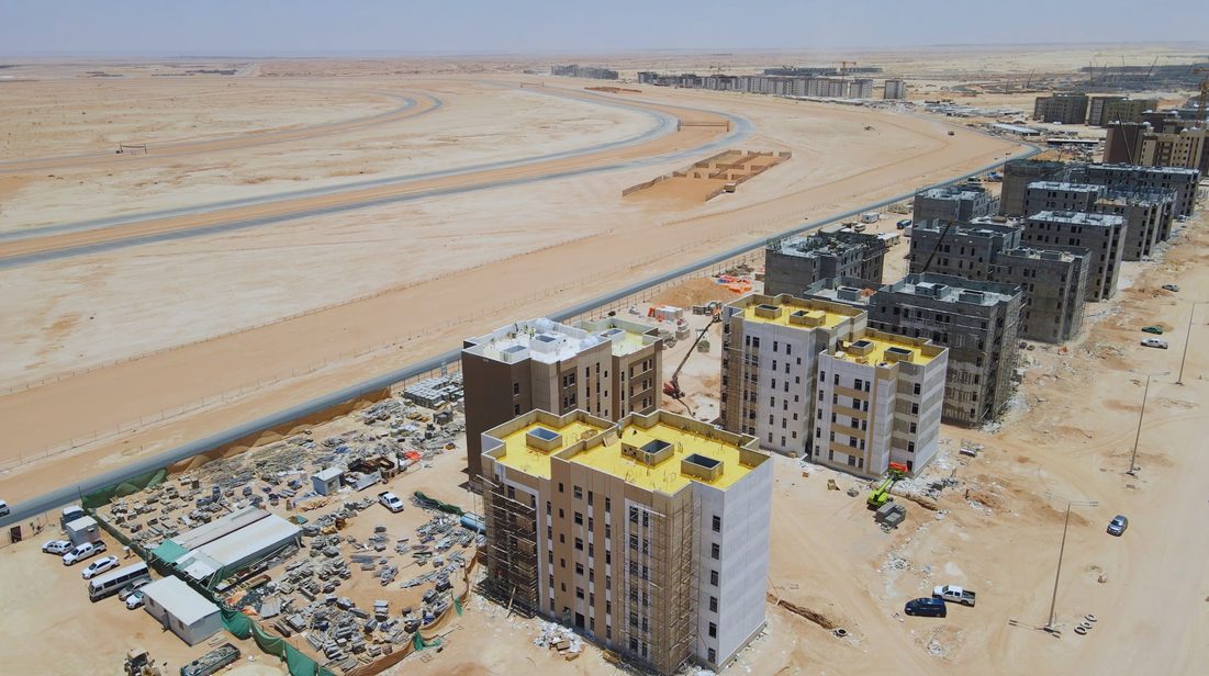 Aerial view of the Al Forsan project in Riyadh, showing completed and in-progress multistory residential buildings