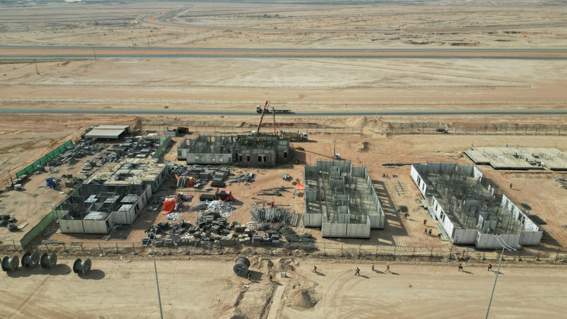 Aerial view of the Ebayya program showing villas at different points in the cycle